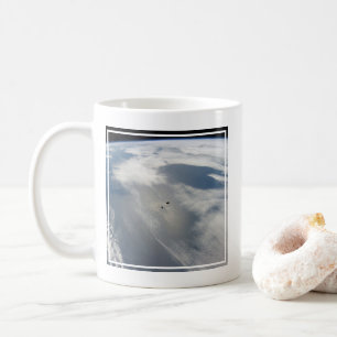 Tiny Satellites Orbit Above A Part Of Earth. Coffee Mug