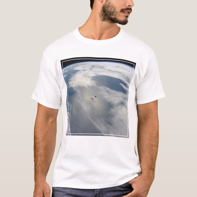 Tiny Satellites Orbit Above A Part Of Earth. T-Shirt (Front)