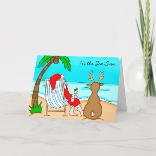 Tis the Sea_Sun Santa on Beach with Reindeer Holiday Card