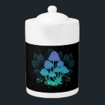 Toadstools in Bushes Teapot<br><div class="desc">Mysterious,  bioluminescent,  hallucinogenic,  bright toadstools with bushes of marsh plants on night,  dark,  glowing background. Glowing mushrooms. Goblincore,  Mushroomcore, </div>