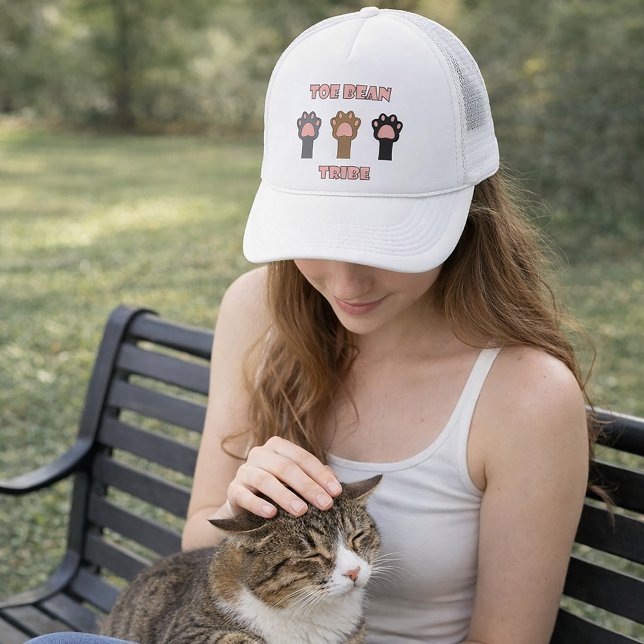 Toe Bean Tribe Funny Kitty Cat Paws Pink Trucker Hat (A hat with three cat paws and the words toe bean tribe in pink letters with a gray outline.)