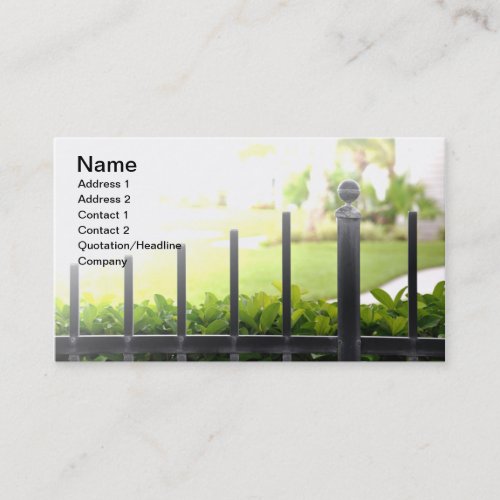 top of an outdoor black iron fence business cards