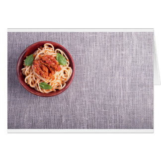 Top view of a gray mat with a spaghetti cards
