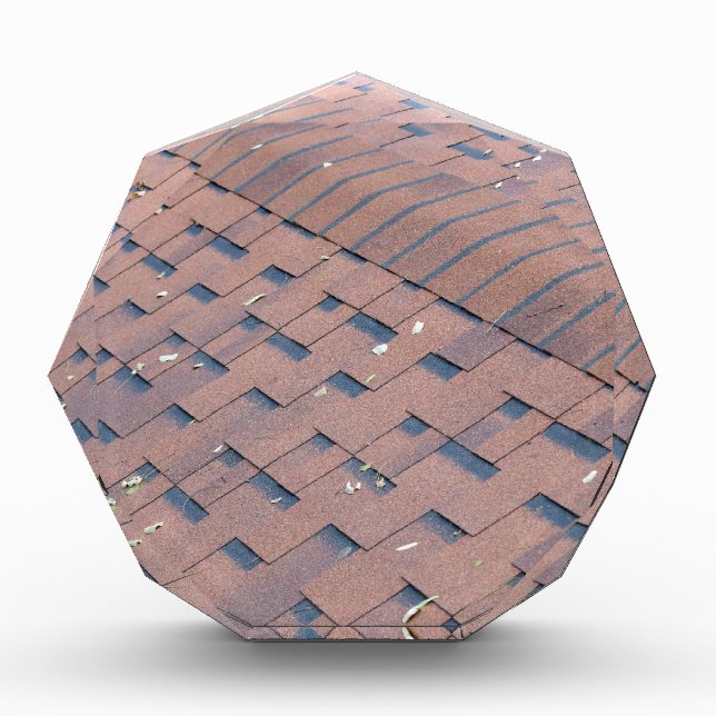Top view of brown roof shingles with a few autumn award (Front)
