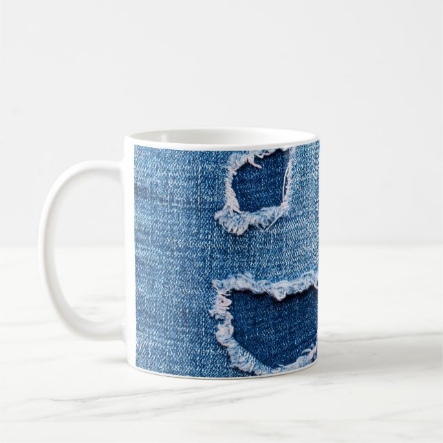 Torn denim fabric texture, blue hues. coffee mug (Left)