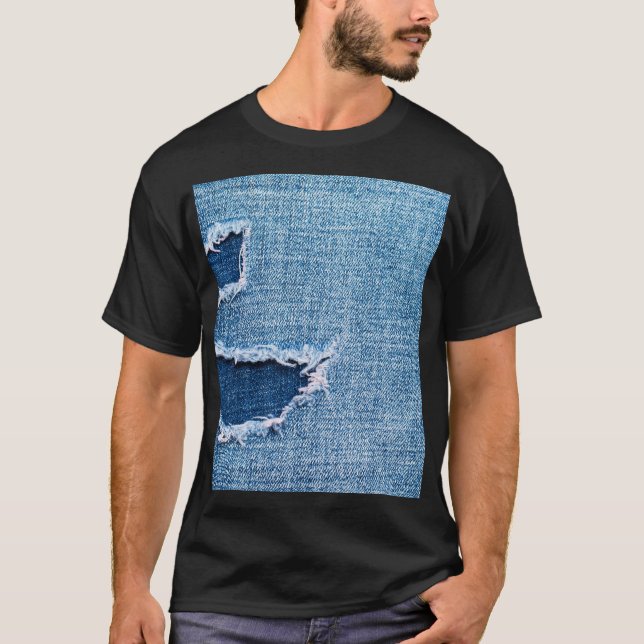 Torn denim fabric texture, blue hues. T-Shirt (Front)