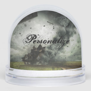 Tornado storm destroying house snow globe