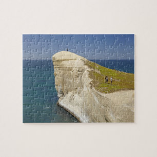 Tourists on cliff top at Tunnel Beach Jigsaw Puzzle
