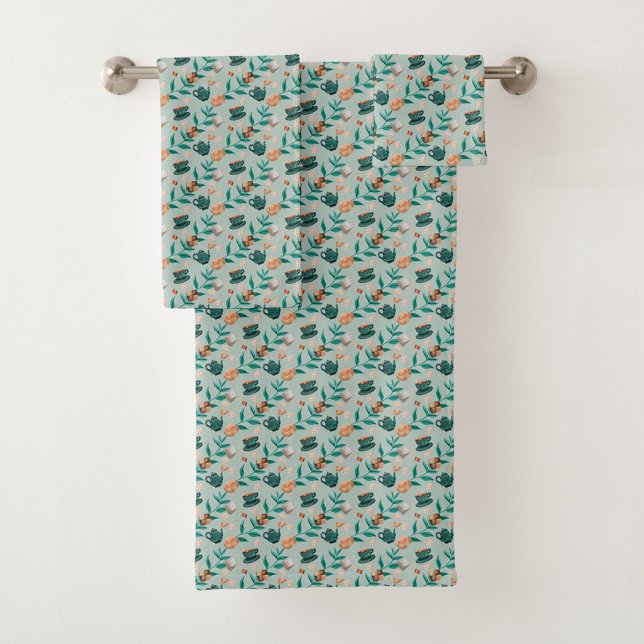 Towels with a teal floral pattern hang  (Creator Uploaded)
