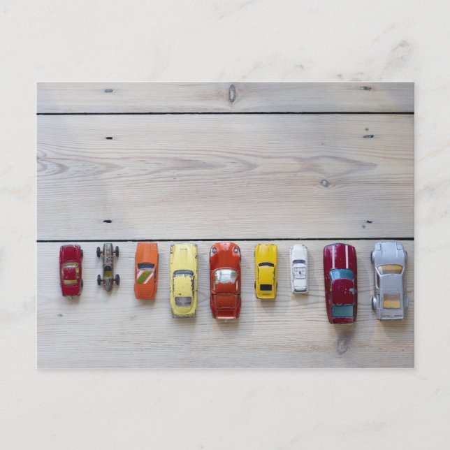 Toy cars lined up in a row on floor postcard (Front)