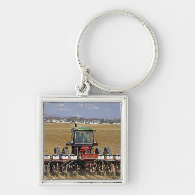 Tractor pulling a seed corn planter. keychain (Front)