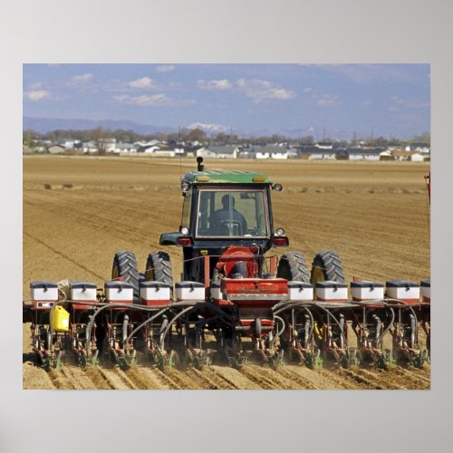 Tractor pulling a seed corn planter poster