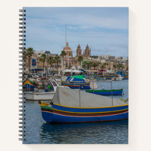 Traditional colorful fishing boats in Malta Notebook