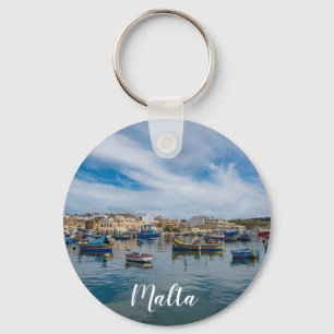 Traditional colorful fishing boats in the harbor keychain