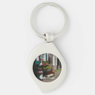Traditional Dutch wooden shoes on street Keychain
