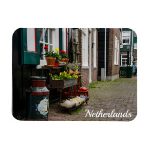 Traditional dutch wooden shoes on street magnet