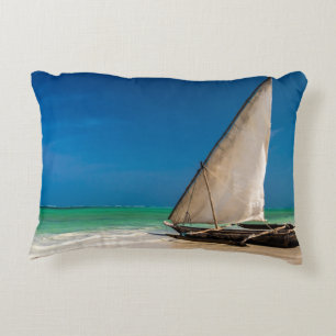 Traditional fishing boat on the beach accent pillow