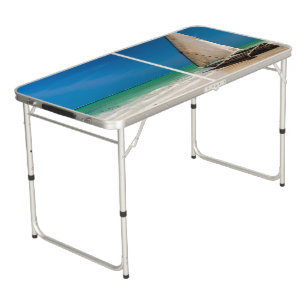 Traditional fishing boat on the beach beer pong table
