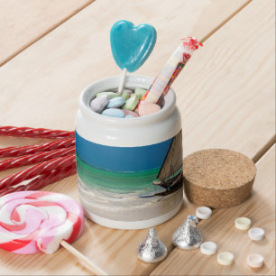 Traditional fishing boat on the beach candy jar