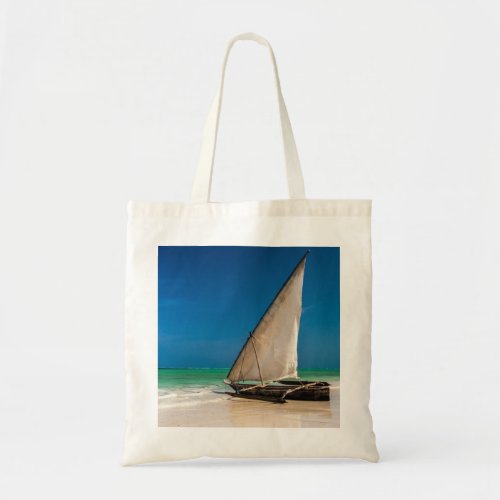 Traditional fishing boat on the beach tote bag