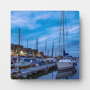 Traditional fishing town night scene plaque