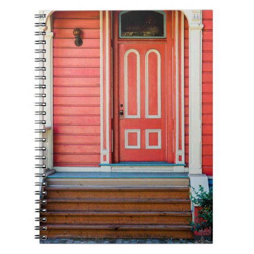 Traditional red painted wooden door and porchdoor notebook