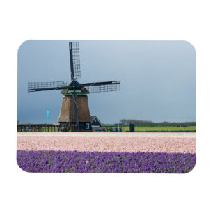 Traditional windmill with pink and purple flowers magnet