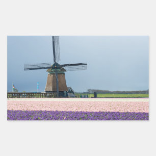 Traditional windmill with pink and purple flowers rectangular sticker