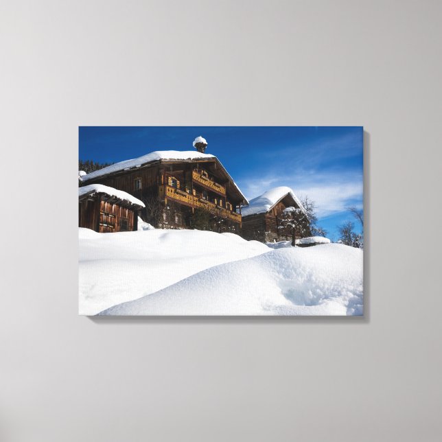 Traditional wooden cabins in de snow canvas print (Front)