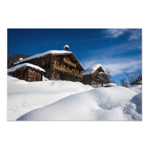 Traditional wooden cabins in de snow photo print