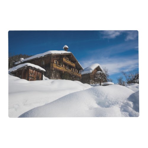 Traditional wooden cabins in de snow placemat
