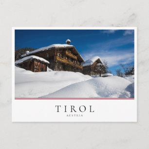 Traditional wooden cabins in de snow postcard