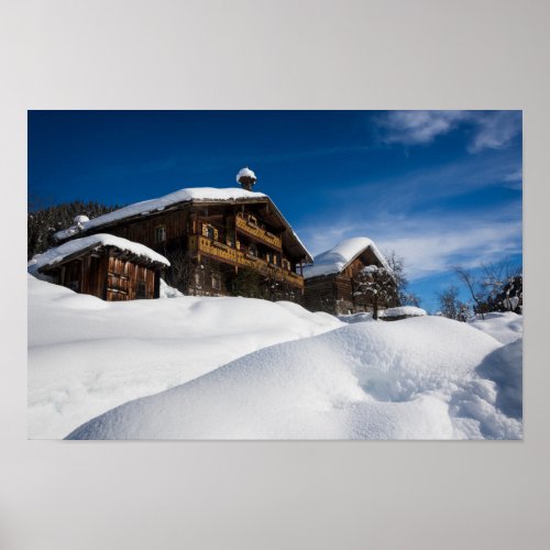 Traditional wooden cabins in de snow poster