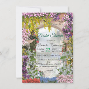 Trailing flowers over an archway at the lake invitation