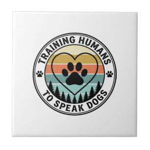 Training Humans to Speak Dogs Vintage Paw Badge_1 Ceramic Tile