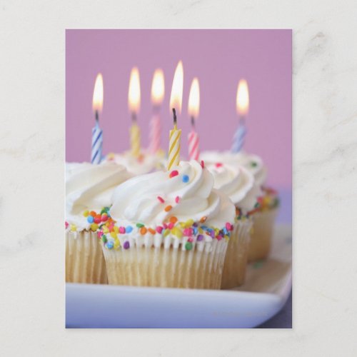 Tray of birthday cupcakes with candles postcard