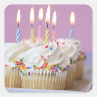 Tray of birthday cupcakes with candles square sticker