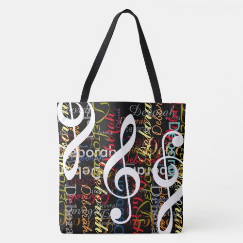 treble clefs with a pattern of colorful names tote bag