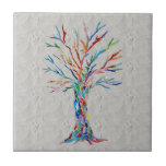Tree of Life Gray Ceramic Tile<br><div class="desc">This decorative tile features a unique Tree of Life design on a background in shades of gray. It was originally made in mosaic using tiny pieces of brightly colored glass. Please note that the background is in different shades and will not match up seamlessly however is perfect for an accent...</div>