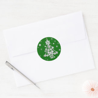 Tree Ornament and Snowflakes Over Green Classic Round Sticker