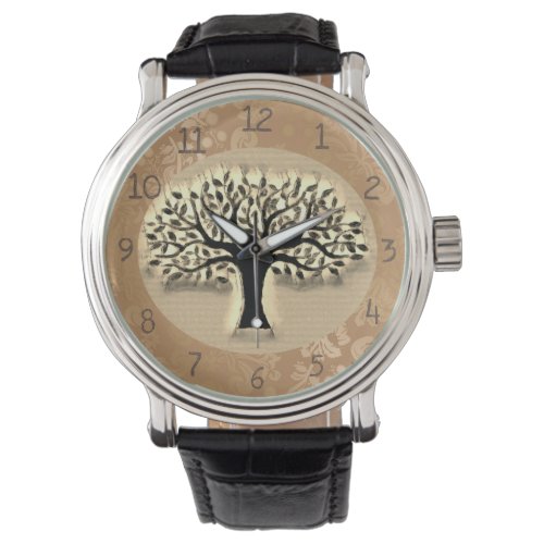 Tree stands in front of a landscape clock watch