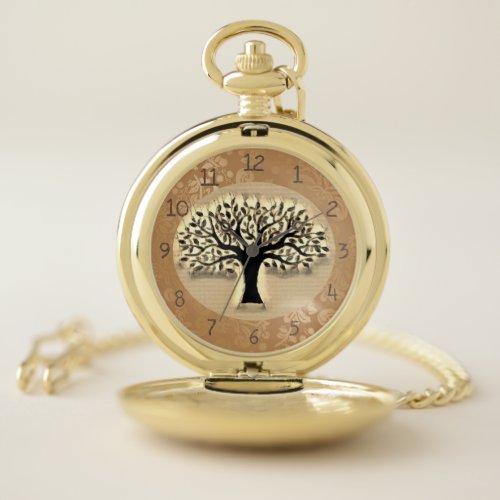 Tree stands in front of a landscape clock watch