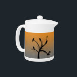 Tree with Crows Teapot<br><div class="desc">A spooky scene. A bare silhouette of a tree, laden with silhouettes of crows (commonly called a Murder of Crows). On a background of gradient orange and grey</div>