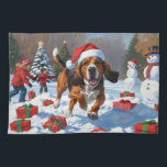 Treeing Walker Coonhound Snow with Christmas Hat Kitchen Towel<br><div class="desc">A spirited Treeing Walker Coonhound runs happily through the snowy winter scene,  wearing a festive red Christmas hat. This lively design highlights the breed’s sleek coat,  athletic build,  and determined personality while capturing the warmth and joy of the holiday season. A heartwarming winter moment full of festive cheer.</div>