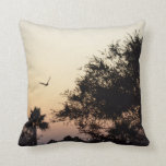 trees and flying bird against florida sunset throw pillow
