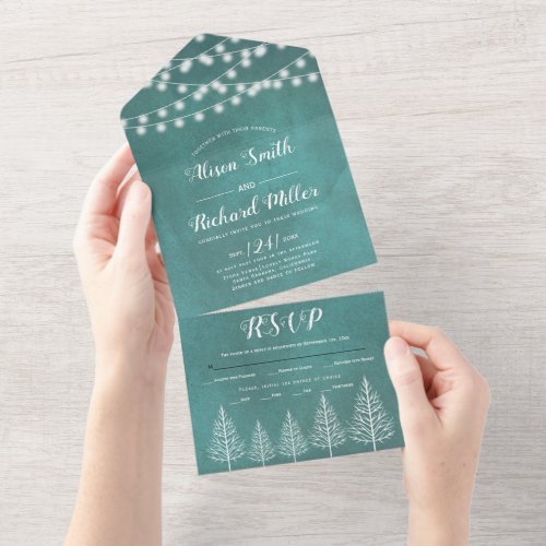 Trees and lights stained teal blue winter wedding all in one invitation