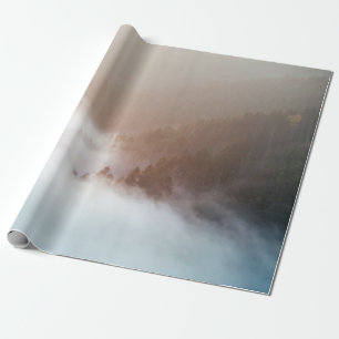 Trees on mountain covered with fogs wrapping paper