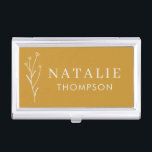 Trendy Boho Chic Minimalist Mustard Yellow Custom Business Card Case<br><div class="desc">Our Trendy Boho Chic Minimalist Mustard Yellow Custom Business Card Case, the perfect accessory for the modern professional. Designed with elegance and sophistication in mind, this business card case features a chic mustard yellow exterior adorned with a delicate flower drawing. The minimalist design, complemented by trendy typography, ensures a sleek...</div>