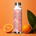 Trendy Chevron Pattern large name block coral Water Bottle<br><div class="desc">A bold, graphic design with colorful shades of coral zig zags with a fun color block to add your name or any text. The bright chevron pattern is a modern, trendy pattern with a punch of color. You can add a name, monogram or other custom text. If you need to...</div>