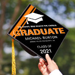 Trendy Masculine Graduate for Him Graduation Cap Topper<br><div class="desc">Modern graduation cap topper for him featuring a stylish black background that can be changed to any color,  a graduate cap,  2 cool orange stripes,  the saying "the tassel was worth the hassle",  the students name,  the high school/college,  and class year.</div>